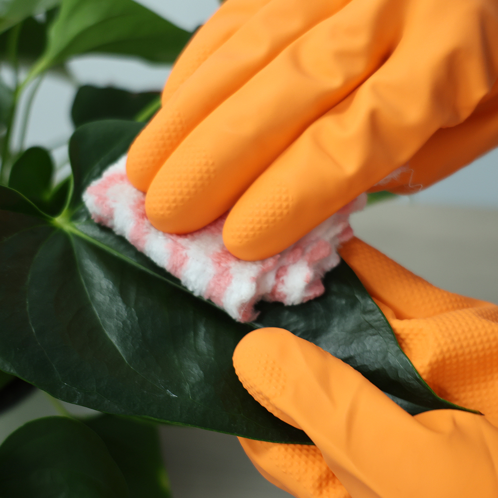 Reusable nitrile gardening gloves providing dexterity for potting seedlings.